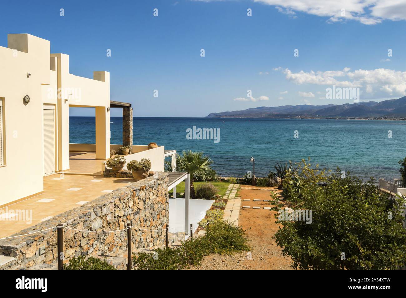 Bird's eye view from the street on a terrace of a beautiful Cretan sea beach in Crete Stock Photo