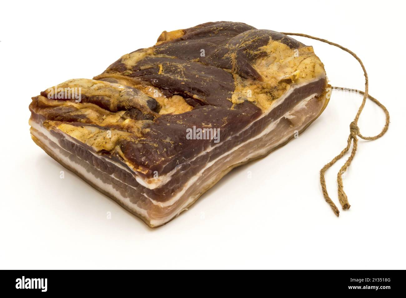 Block smoked bacon with its drying rope on a white background Stock ...