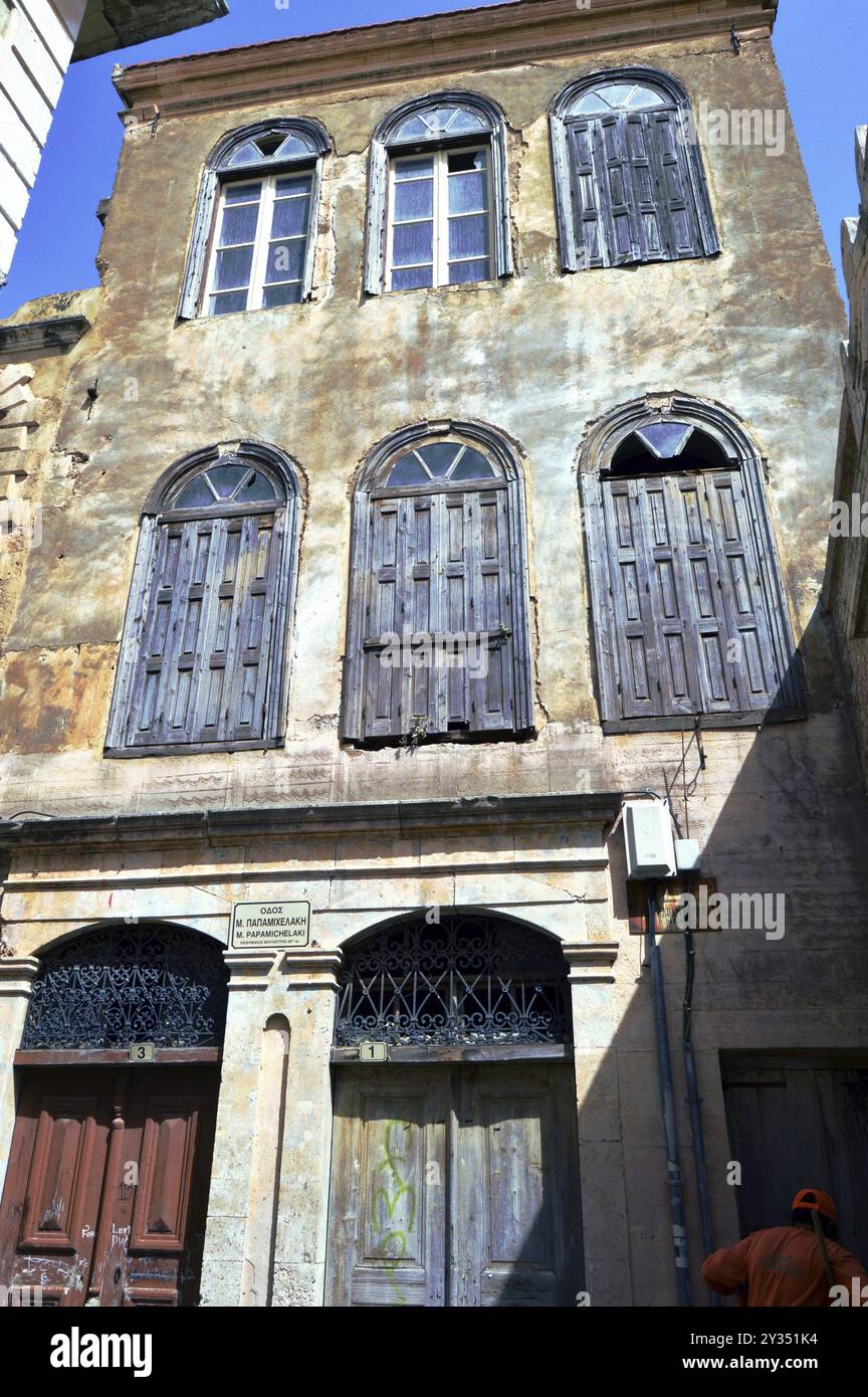 Old facade with tiles to break wooden shutters to close Stock Photo - Alamy