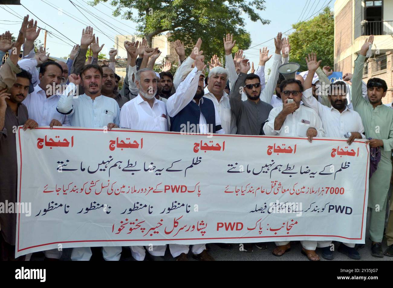 Employees of Public Works Department (PWD) are holding protest demonstration against abolishment of PWD, at Peshawar press club on Thursday, September 12, 2024. Stock Photo