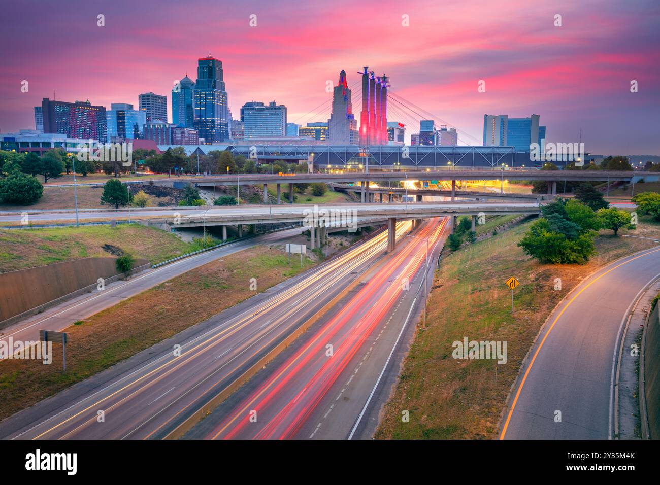 Kansas City, Missouri, USA. Cityscape image of Kansas City skyline with busy highway leading to the city at autumn sunrise. Stock Photo