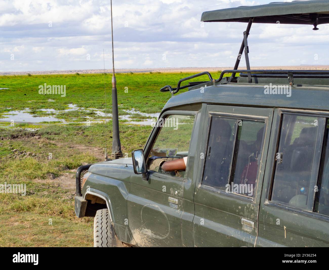 A wildlife ranger working in a National Park guarding from his 4x4 ...