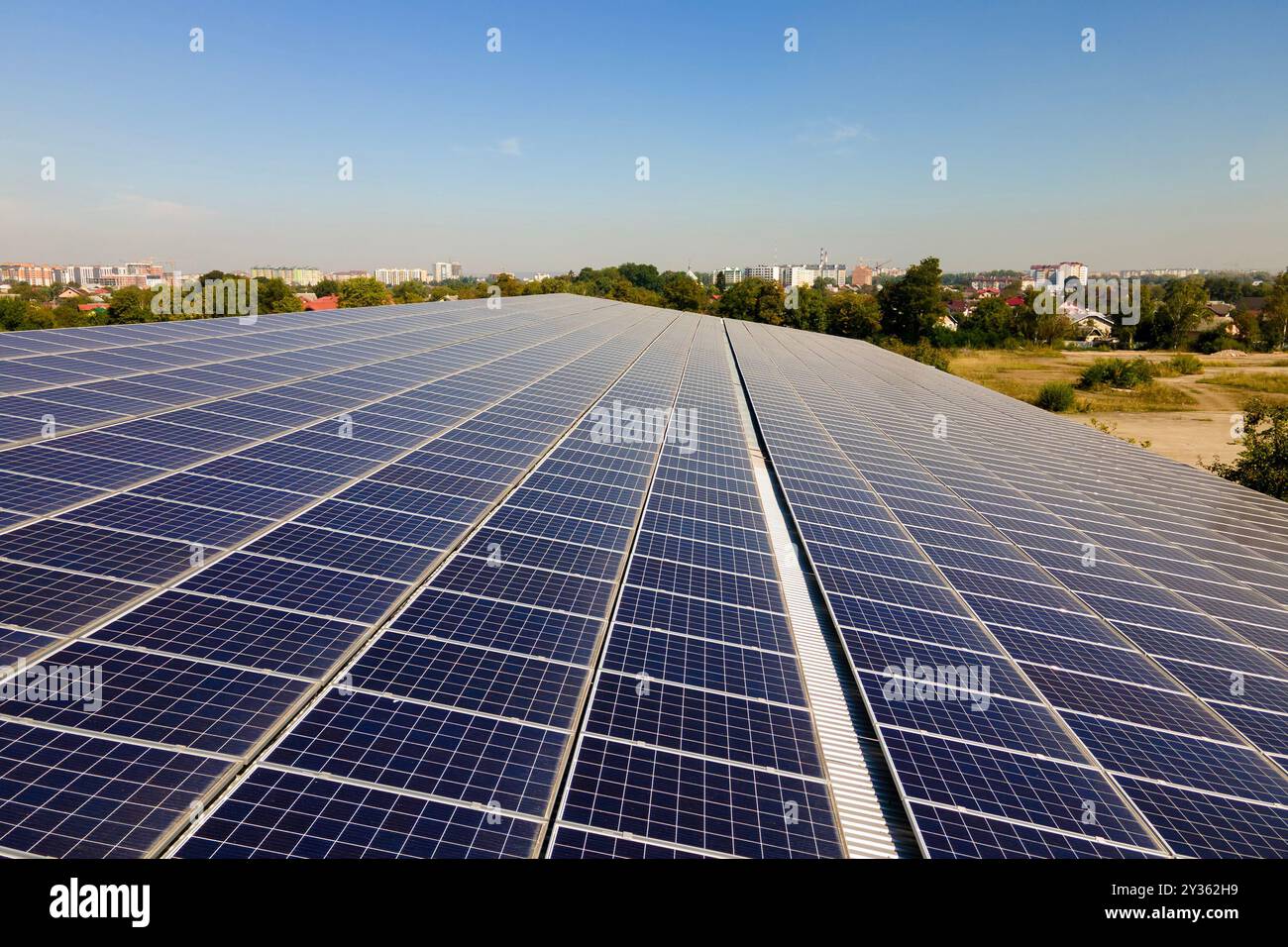 Solar photovoltaic panels installed on building roof for producing ...