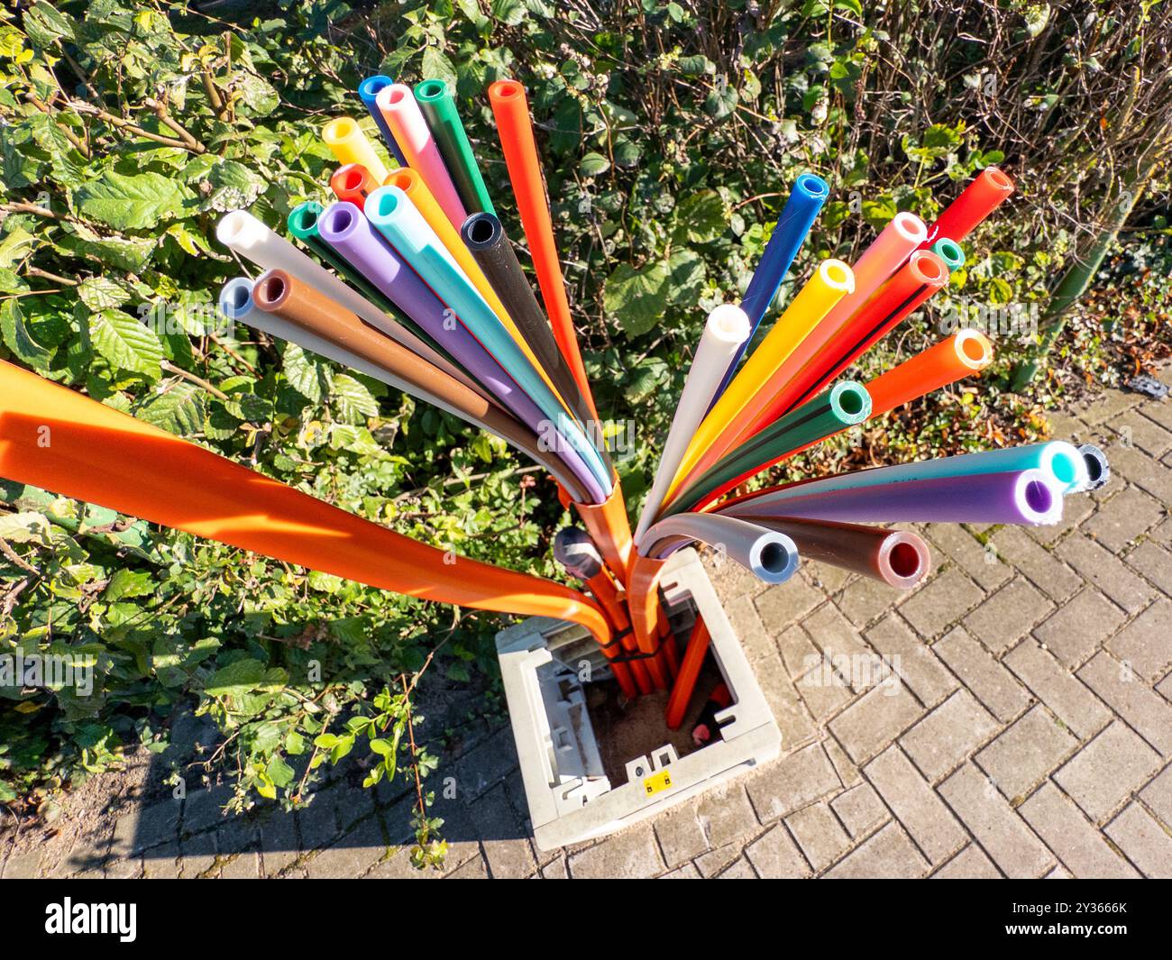 Conduits and fibre optic cables in public waiting to be connected to fibre optic network as part of the fibre optic expansion for high speed internet Stock Photo