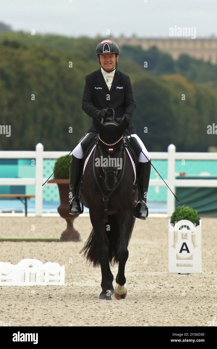 Pepo PUCH of Austria on the horse SAILOR'S BLUE  - Para Equestrian Individual Event - Grade II at the 2024 Paralympic games in Versailles, Paris. Stock Photo