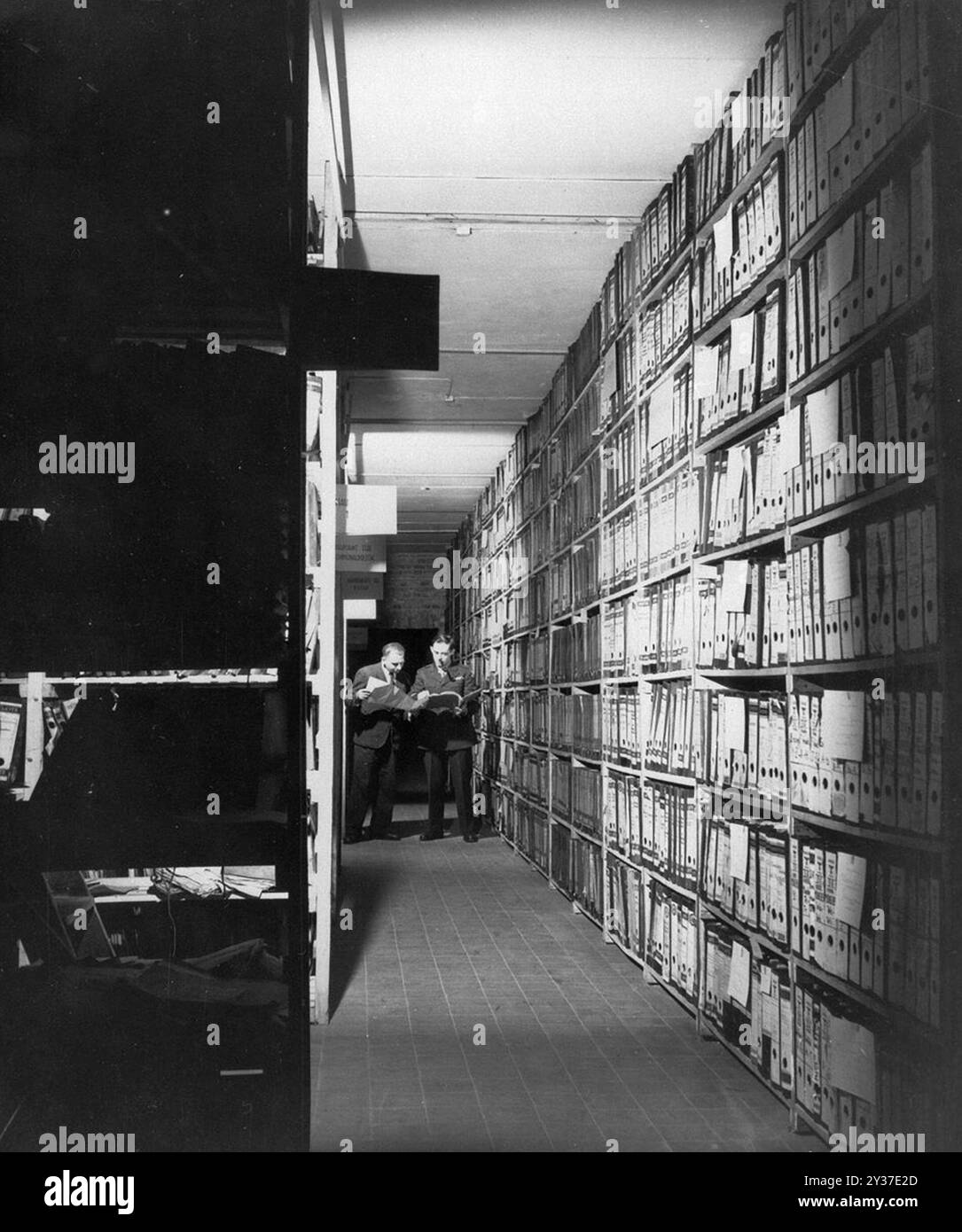 American researchers at the Berlin Document Center peruse captured German records that are to be used as evidence in the war crimes trials. The Nuremberg Trials was a series of trials of major nazi military and political leaders. The trials took place from 1945 to 1949. The first was the International Military Tribunal which tried the big names like Göring, Ribbentrop, Keitel, etc. There were a subsequent 12 trials of groups of men including doctors, the Einsatzgruppen and military high command. Stock Photo