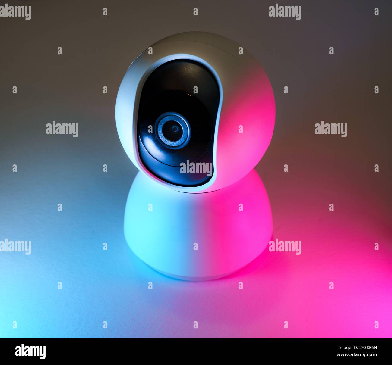 webcam security camera lens neon lights Stock Photo