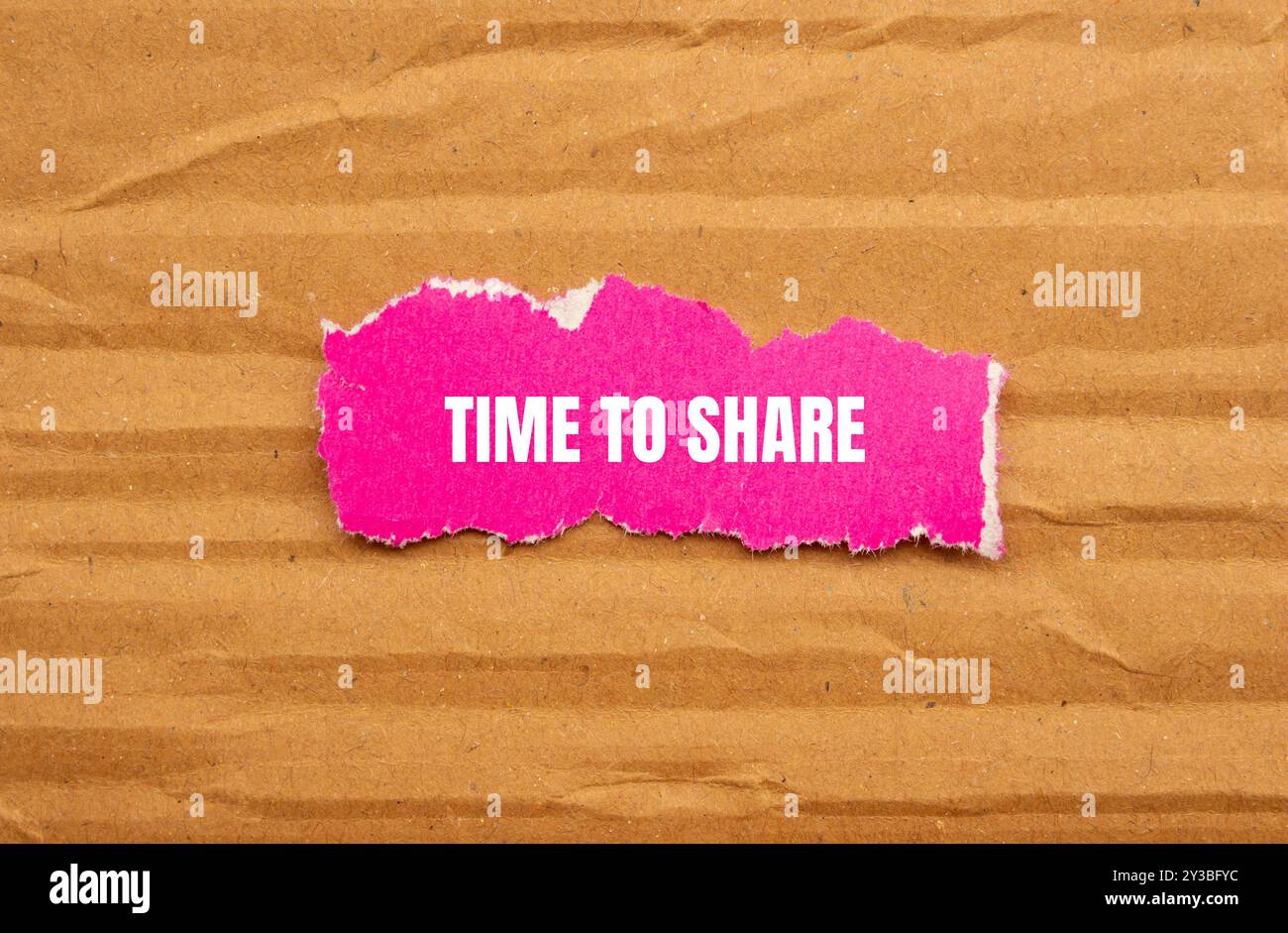 Time to share message written on ripped pink torn paper piece with ...