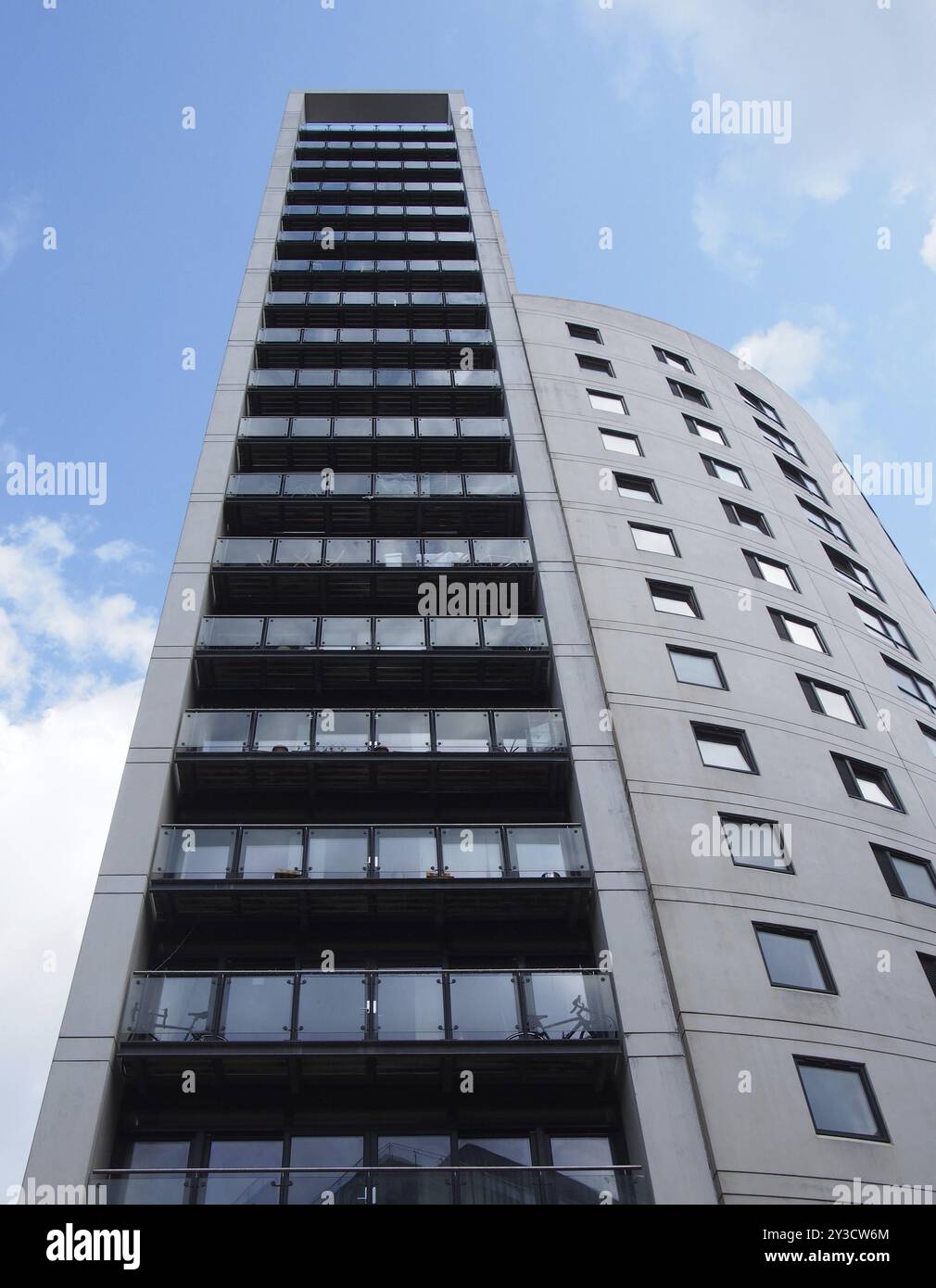 Leeds, west yorkshire, united kingdom, 16 july 2019: clarence house a 218 foot tall modern apartment and retail building in the leeds dock area agains Stock Photo