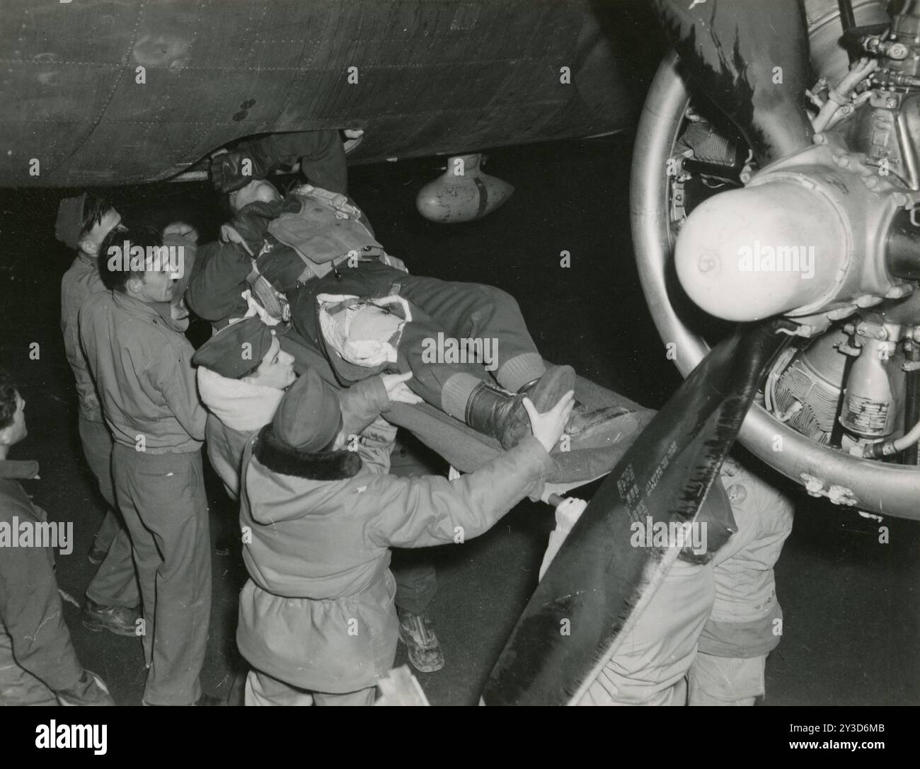 Photo of a wounded bombardier being removed from a Boeing B-17 Flying ...