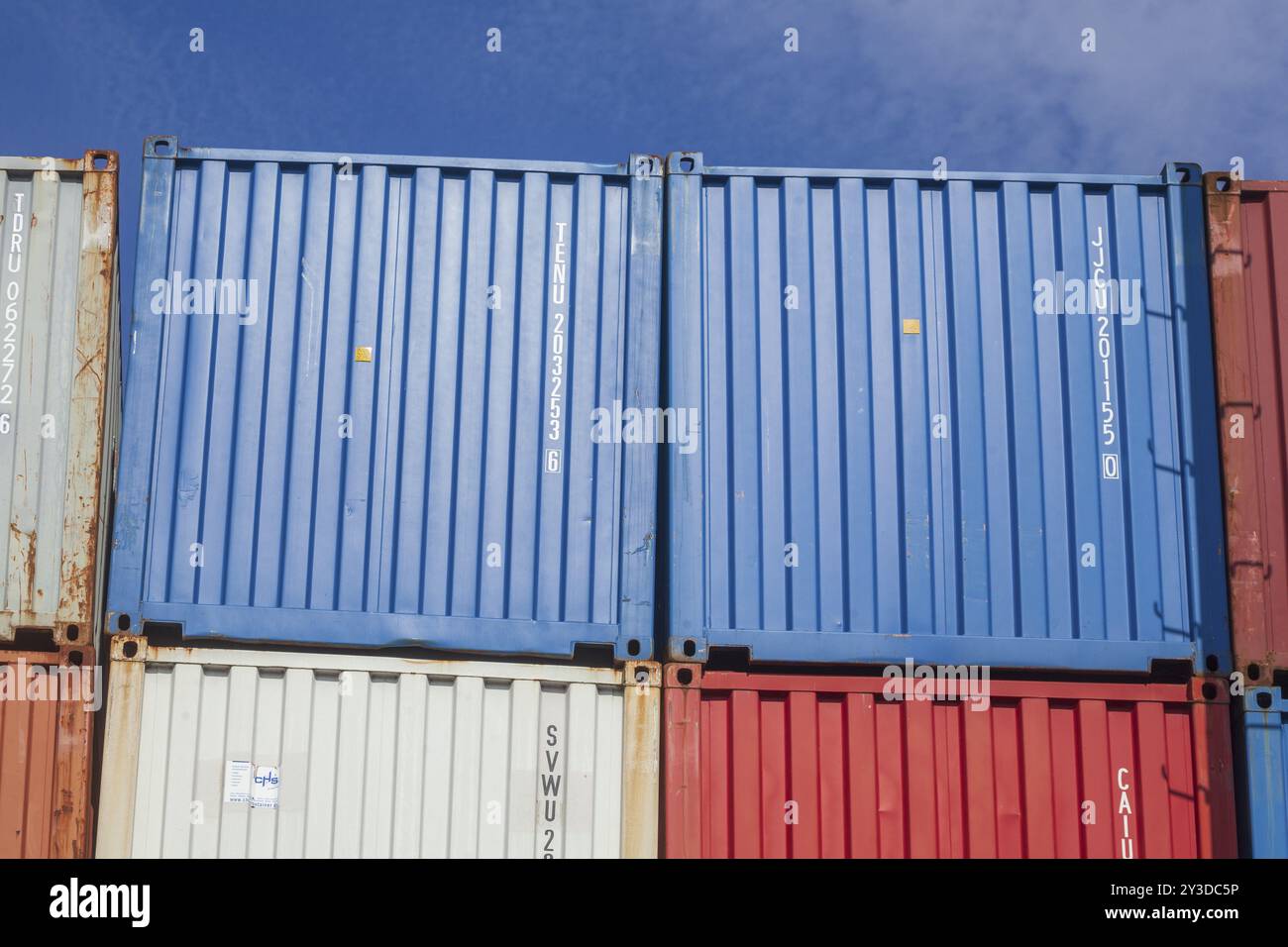 Stacked colourful freight containers at the container terminal in Holz-und Fabrikenhafen, Bremen, Germany, Europe Stock Photo