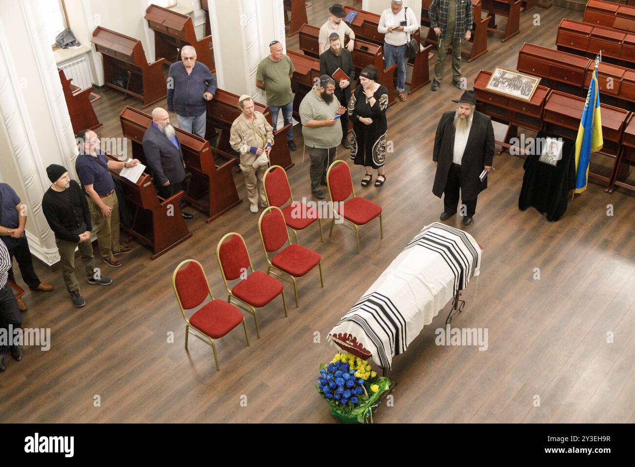 KYIV, UKRAINE - SEPTEMBER 12, 2024 - Chief Rabbi of Ukraine Moshe Reuven Azman stays by the coffin of his adopted son, Ukrainian serviceman Anton (Matisyau) Samborsky during a memorial ceremony at the Central Synagogue (Brodsky Synagogue) in Kyiv, capital of Ukraine. The adopted son of Rabbi Moshe Azman died on the front line. Drafted in May, a week after the birth of his first child, a daughter, he went missing on July 24, days after being deployed to Ukraine’s eastern front. Stock Photo