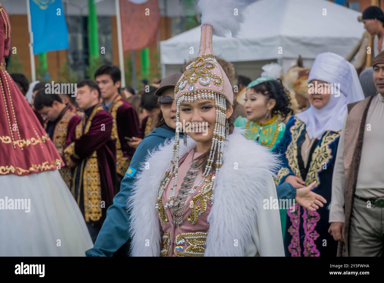 The woman in traditional Kazakh attire, a cultural tradition of Kazakhstan, during the World Nomad Games event in Astana, Central Asia. Stock Photo