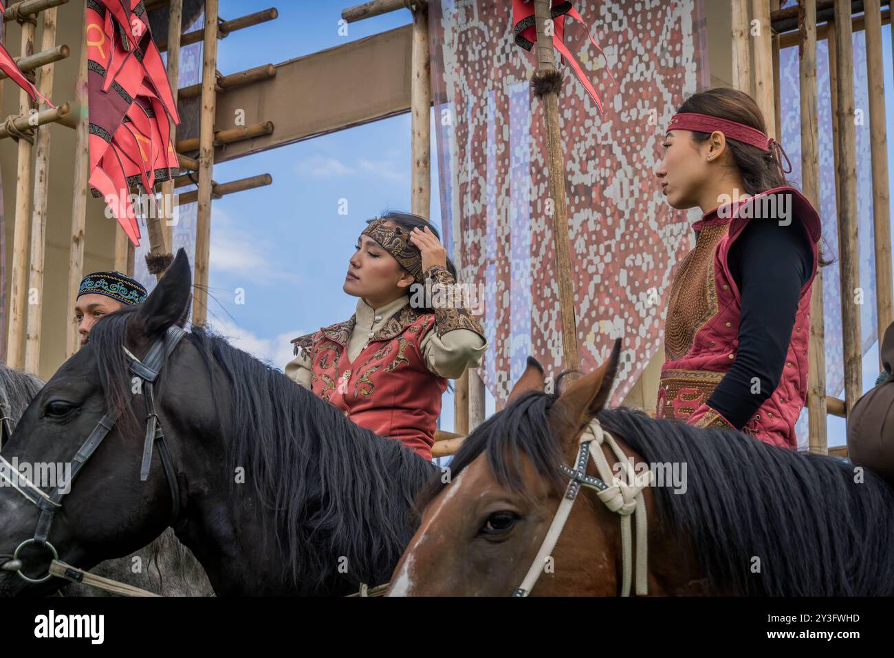 The mounted Kazakh women on the horses, in traditional Kazakh nomadic clothes during the World Nomad Games event in Astana, Kazakhstan, Central Asia. Stock Photo