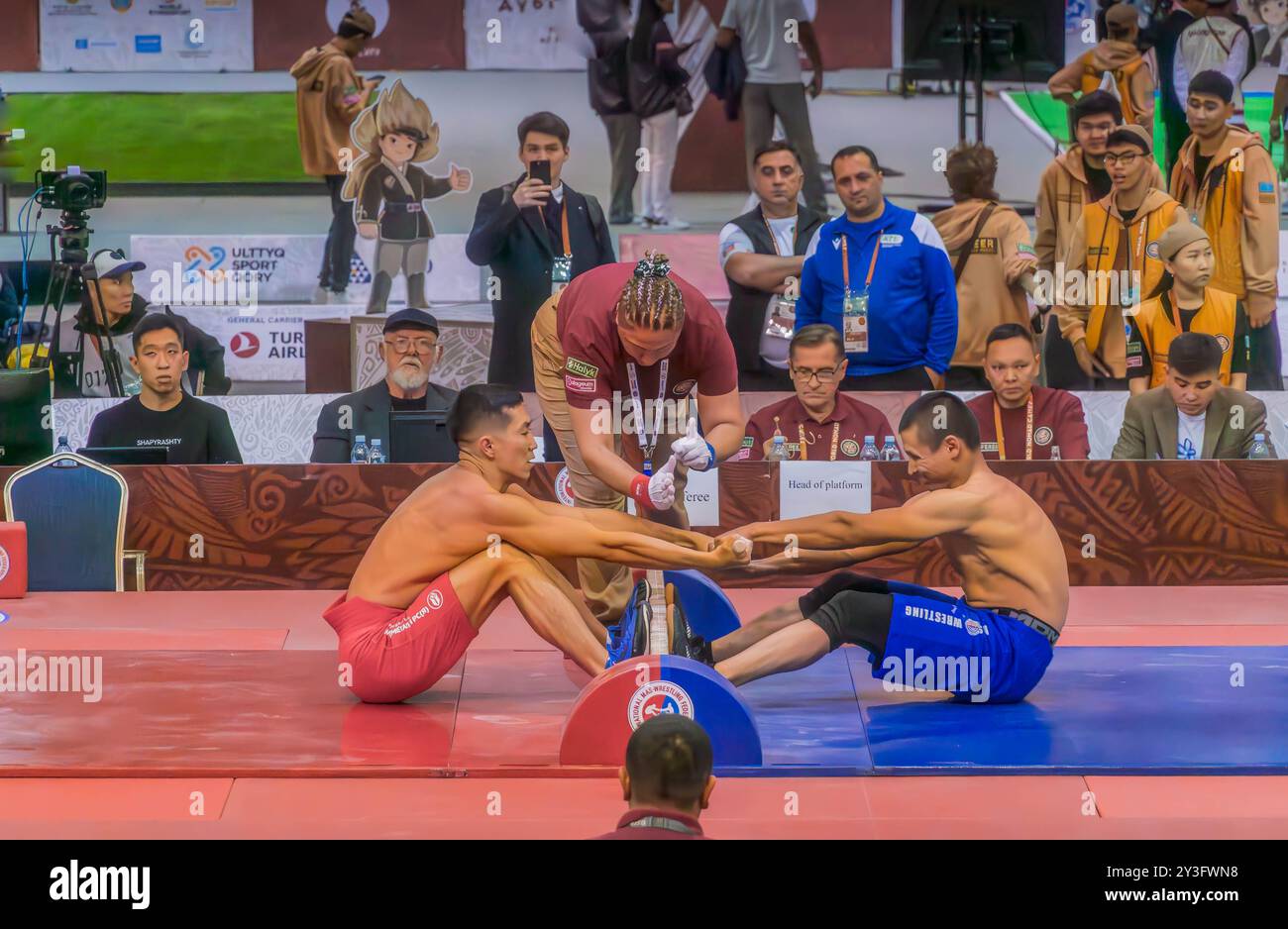 The mas-wrestling match, a traditional Kazakh sport, in Astana, Kazakhstan, during the World Nomad Games. Stock Photo