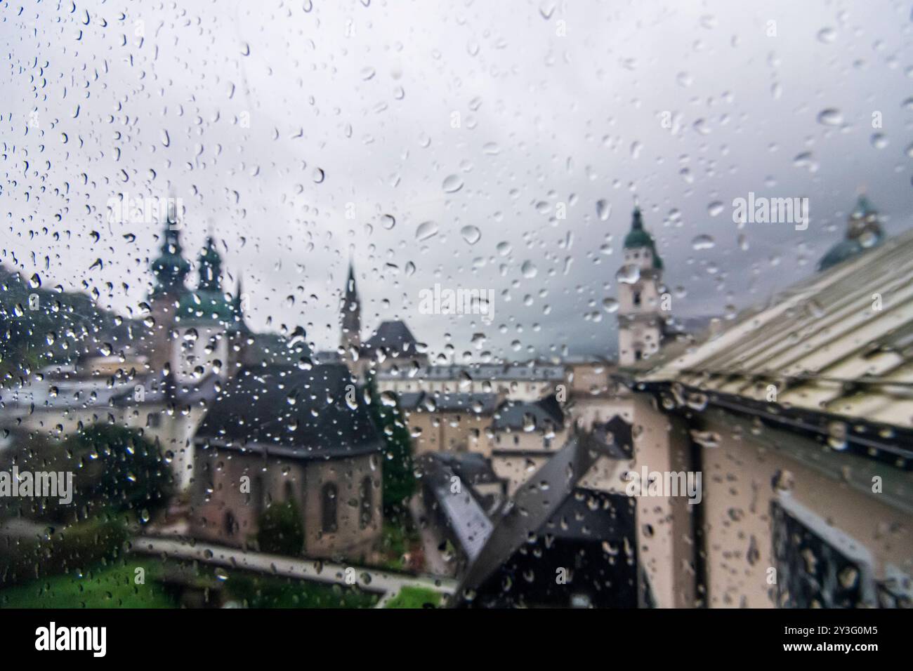 rain drops at window of Festungsbahn funicular railway, view to Old Town, rainy day Salzburg Flachgau Salzburg Austria Stock Photo