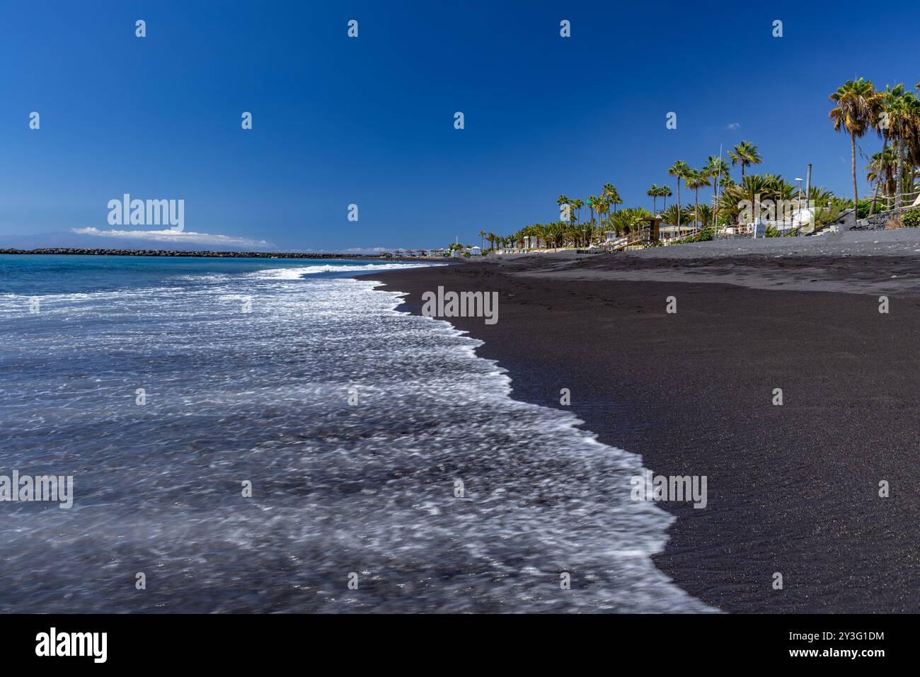 Yellow sand beach, dangerous high waves, Costa Adeje, rough Atlantic Ocean, famous Playa del Duque Teneriffe Stock Photo