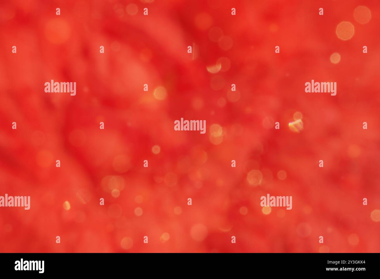 Red abstract blurred background with yellow defocus lights. Stock Photo
