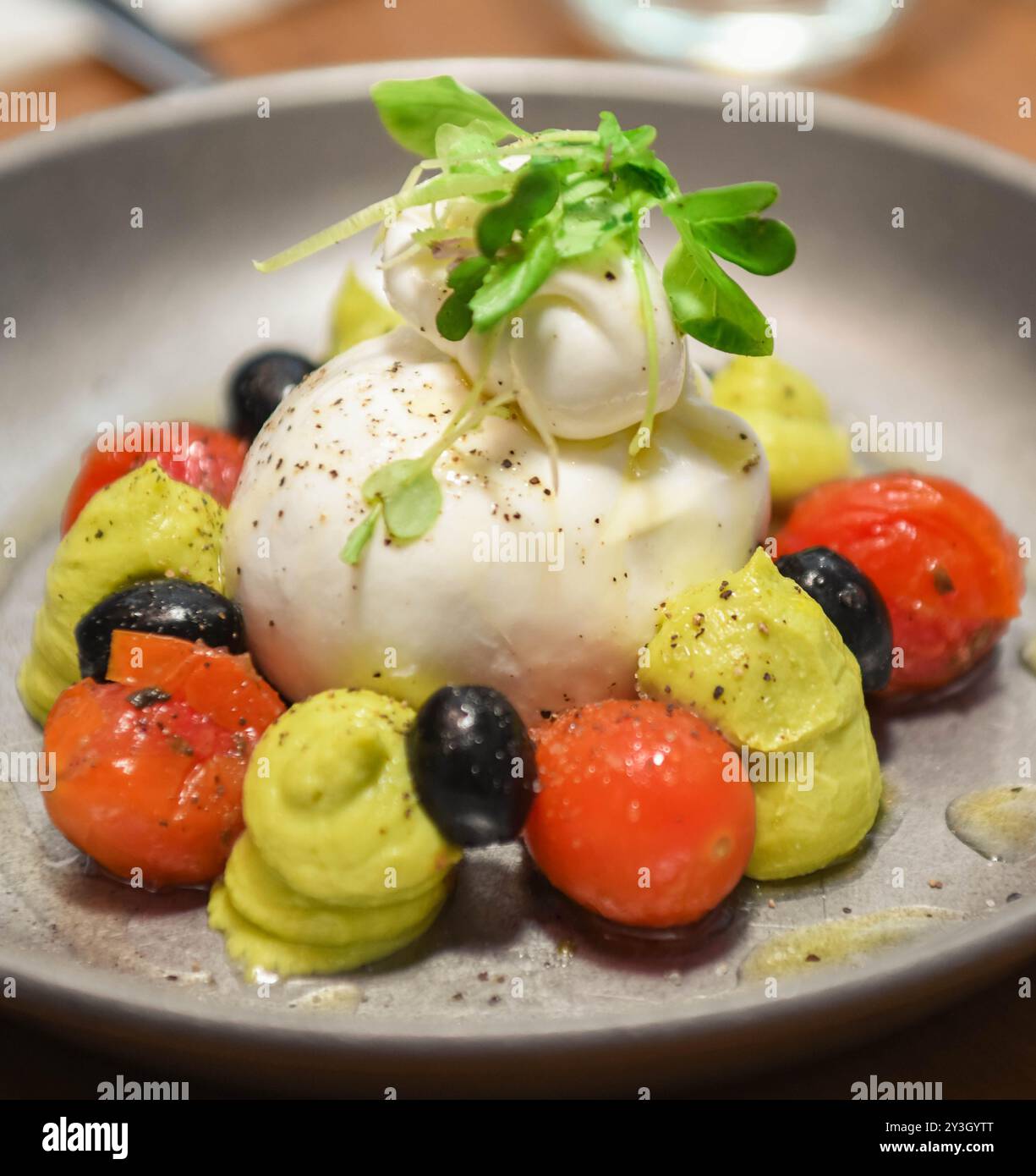 Caprese salad made with buffalo mozzarella and cherry tomatoes typical ...