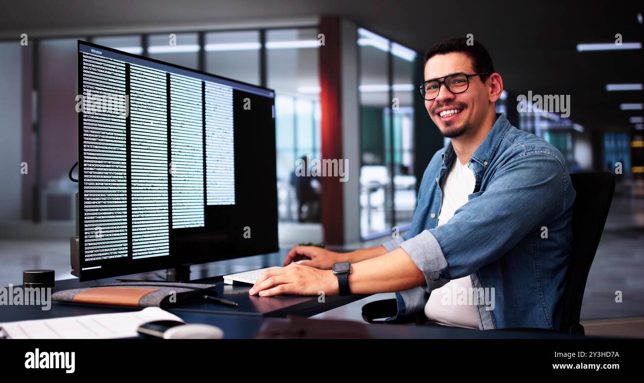 Computer Programmer Writing Program Code On Computer In Office Stock Photo
