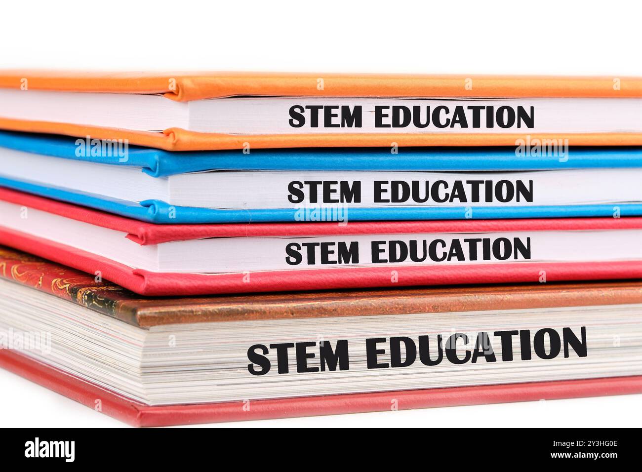 STEM Education. Science Technology Engineering Mathematics. STEM EDUCATION words phrase is repeated on the ends of the notebook Stock Photo
