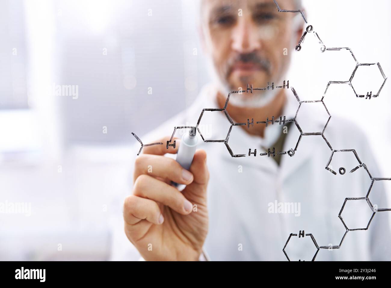 Hand, writing and man by glass wall for formula, chemistry and ...