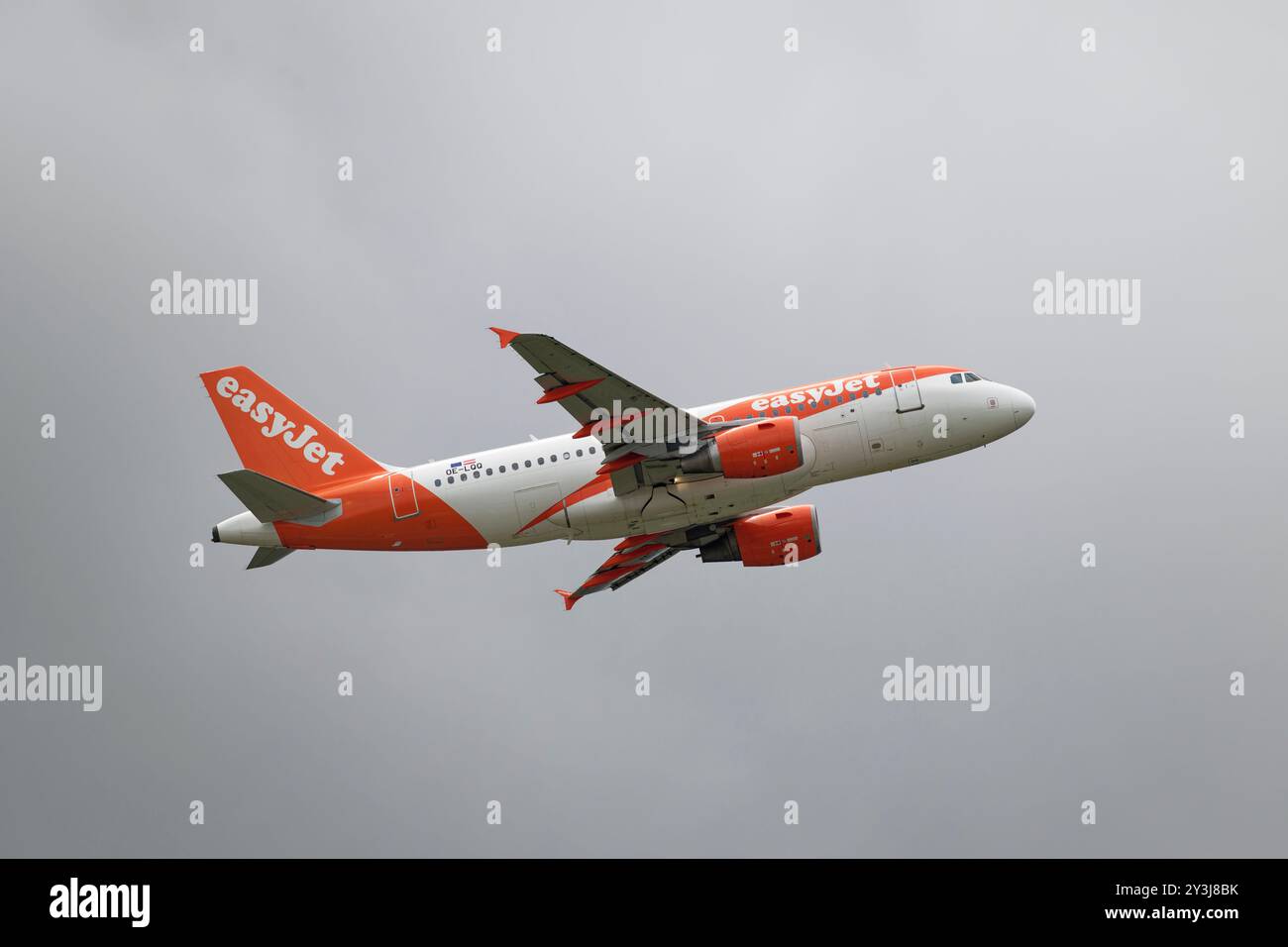 Easyjet Airbus A319-100 passenger airliner OE-LQQ takes off from Gatwick Airport in Southern England Stock Photo