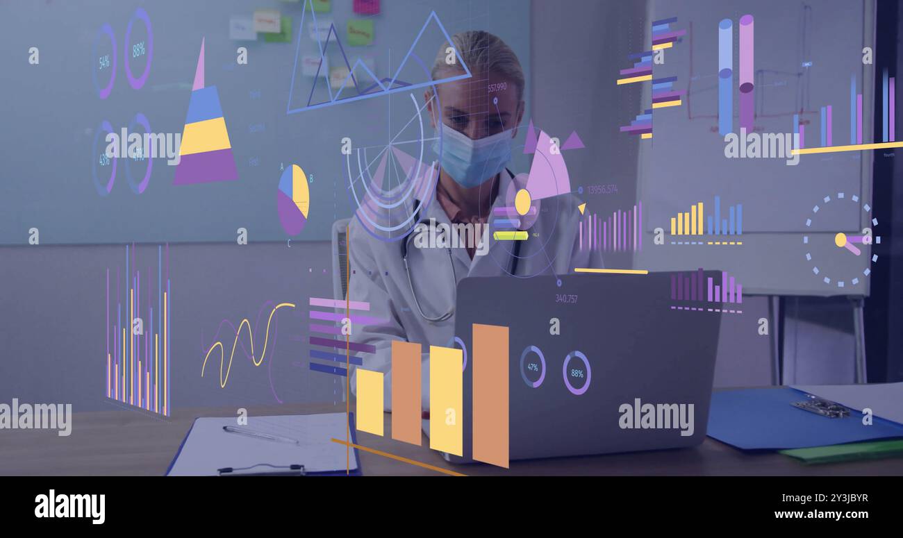 Image of diagrams and data processing over caucasian female doctor using laptop in office Stock Photo
