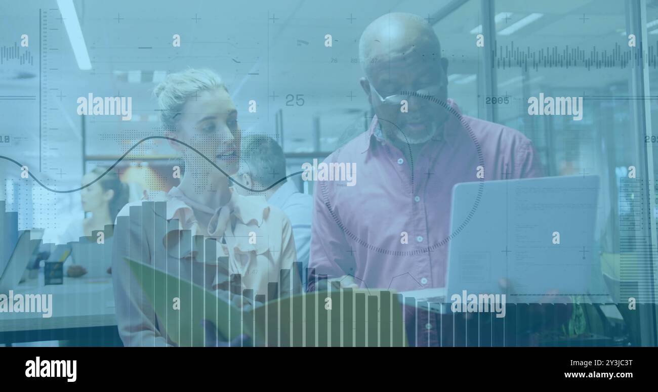 Analyzing documents, business professionals with financial data image over office background Stock Photo
