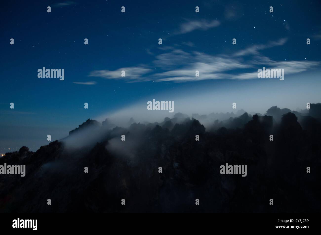 Night view of sulphurous smoke from Merapi Volcano coming out of the ...
