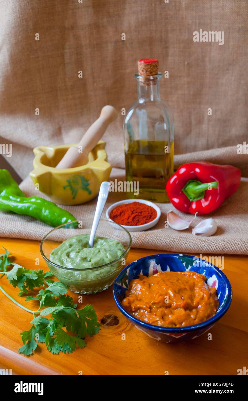 Mojo verde and mojo picon with ingredients. Canary Islands, Spain. Stock Photo