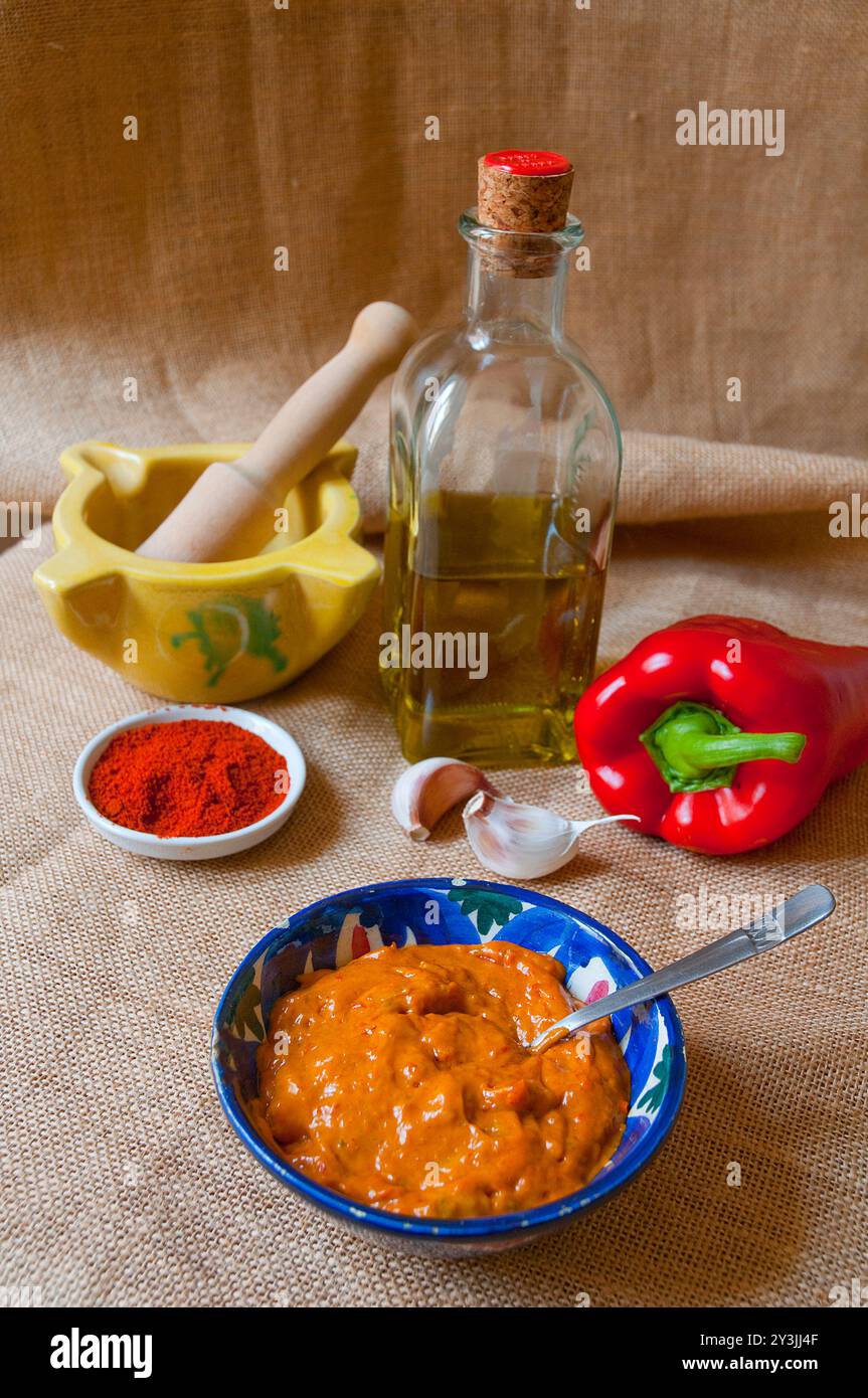 Red mojo with ingredients. Canary Islands, Spain. Stock Photo