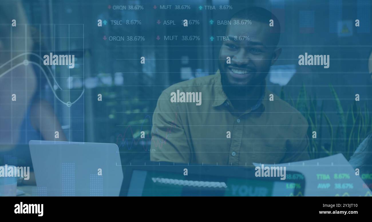 Image of financial data processing over diverse business people using laptop Stock Photo