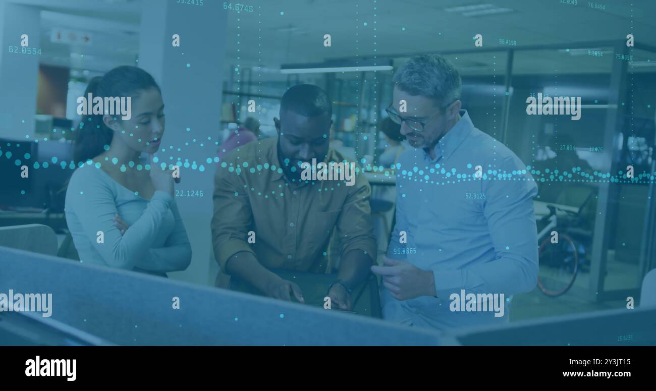 Image of financial data processing over diverse business people using laptop Stock Photo
