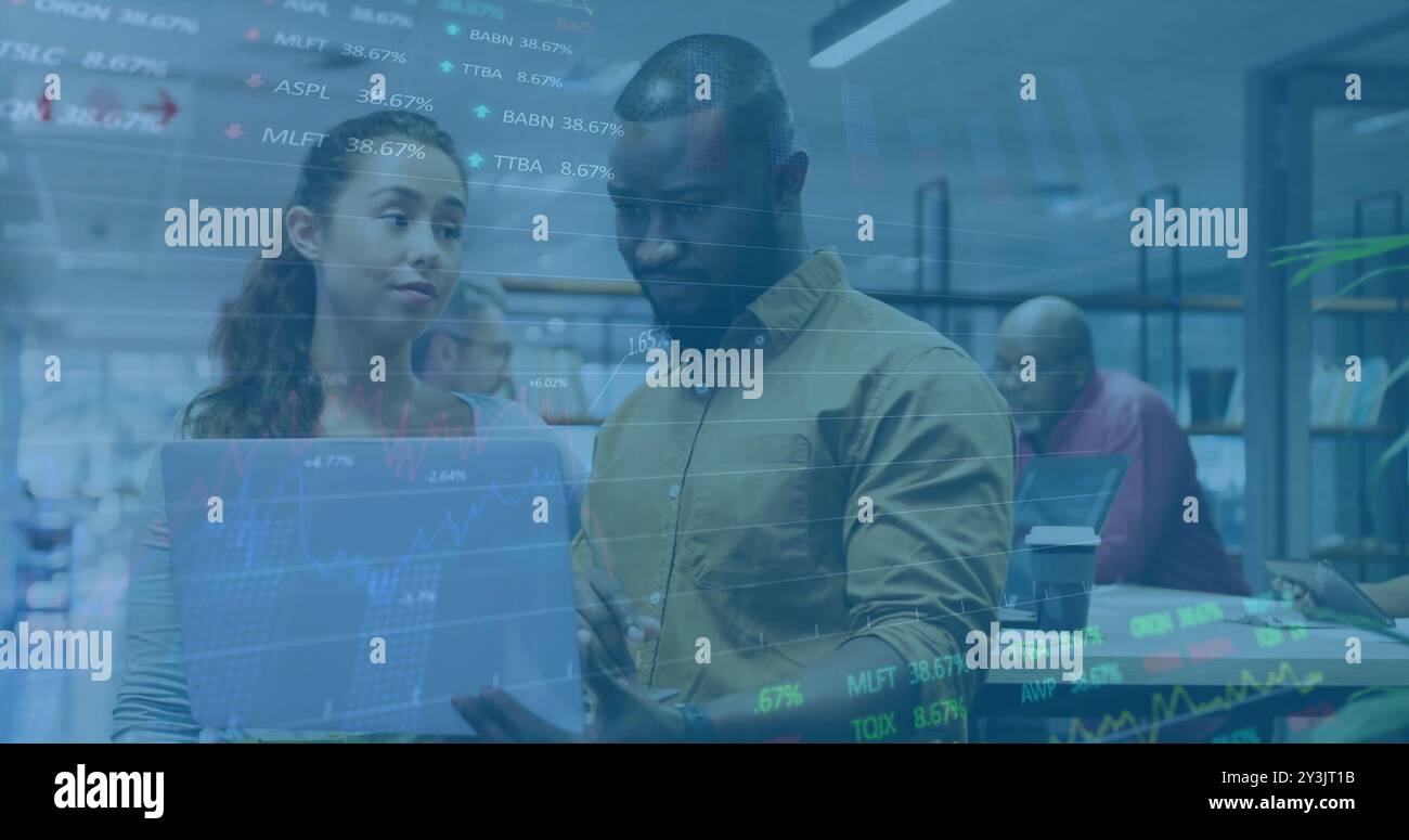 Image of financial data processing over diverse business people using laptop Stock Photo