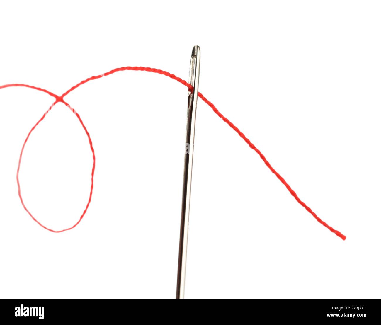 Sewing needle with red thread isolated on white Stock Photo - Alamy