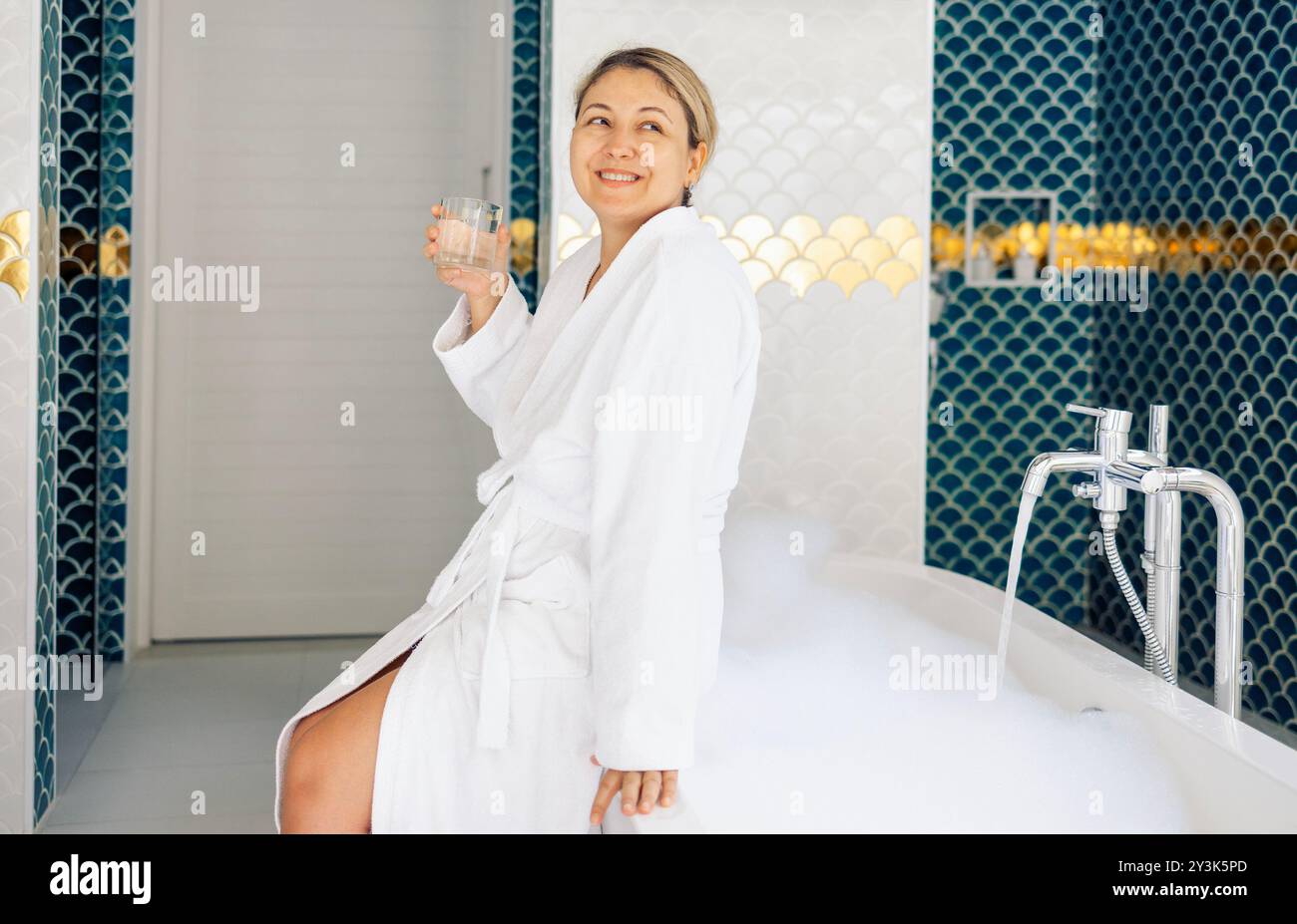 Young blonde woman in bathtub hi-res stock photography and images - Alamy