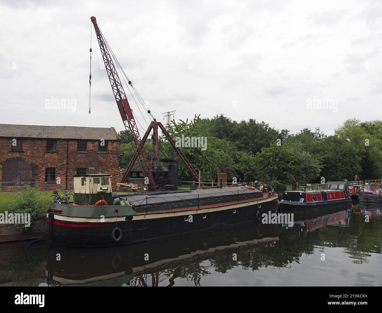 Barges and houseboats on the aire and calder navigation canal at