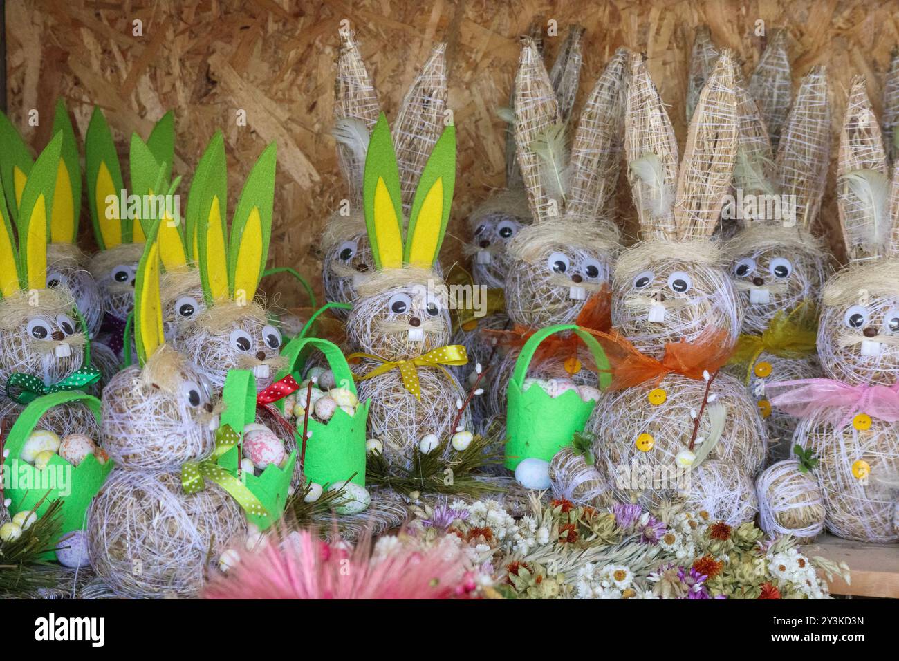 Easter bunny with Easter eggs made of straw Stock Photo