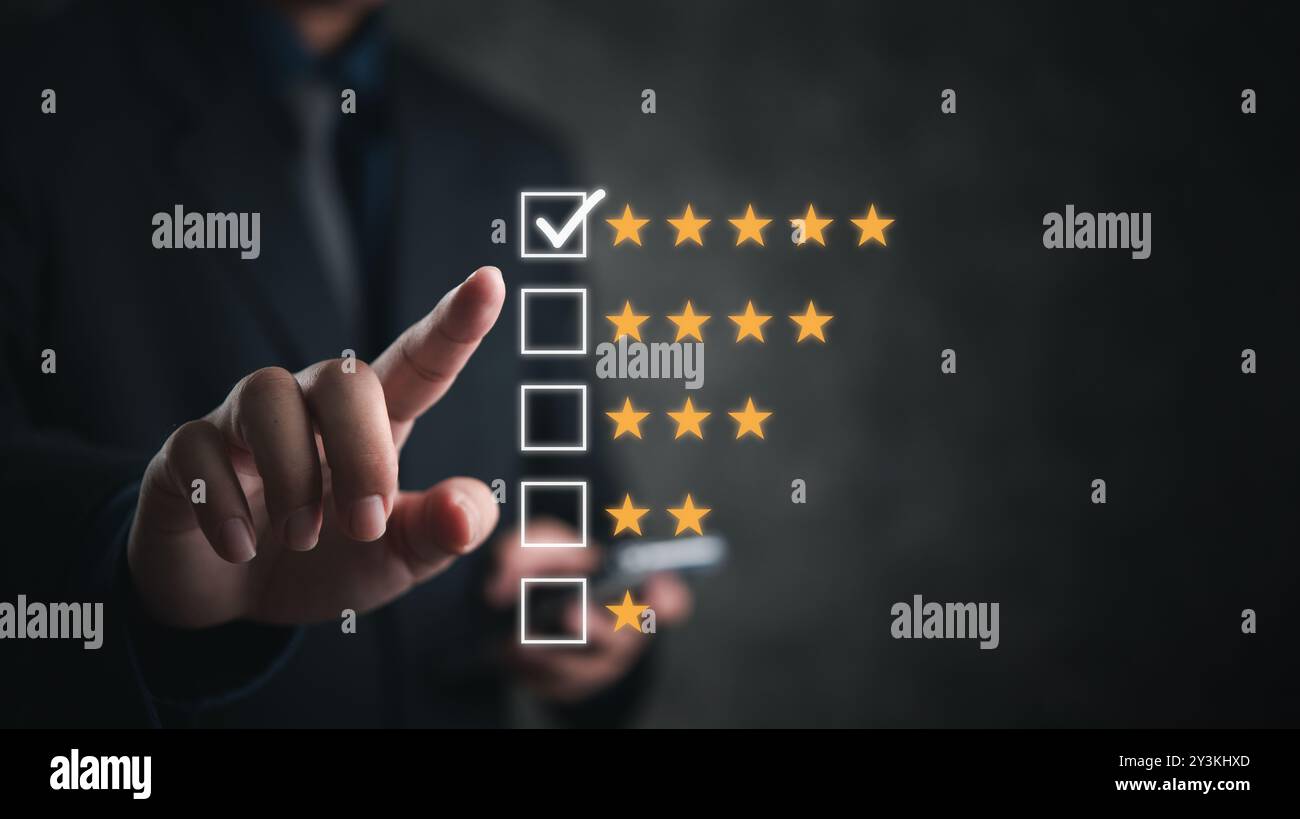 Hand selecting a five-star rating on a digital interface. Symbolizes customer feedback and quality assessment. Suitable for business, service evaluati Stock Photo