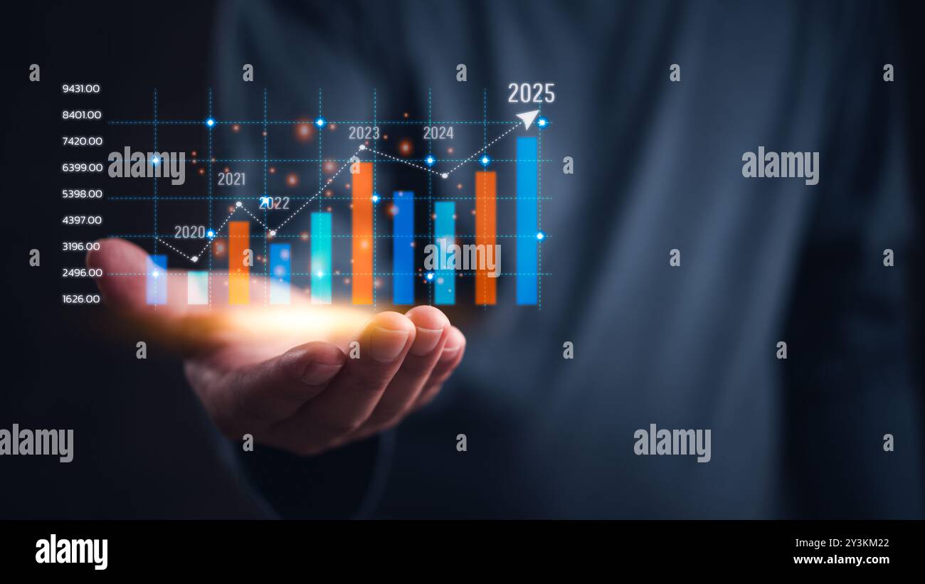 Hand holding a glowing bar chart projecting growth up to 2025. Financial growth, business success, future projections. Trend analysis, market forecast Stock Photo