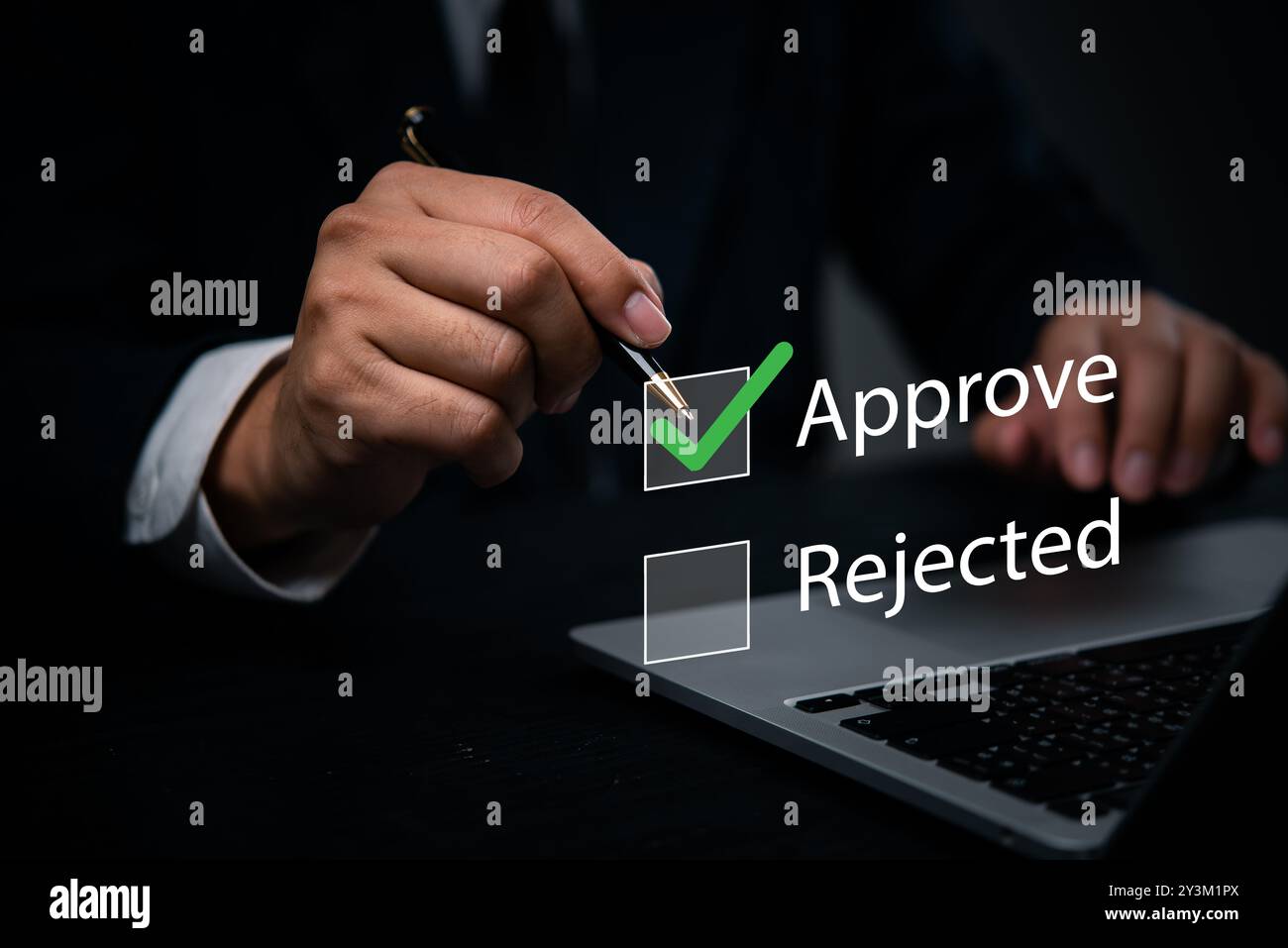 Hand with a pen marking approval on a digital checkbox laptop. management processes, corporate evaluations. Perfect for business approval workflows, q Stock Photo