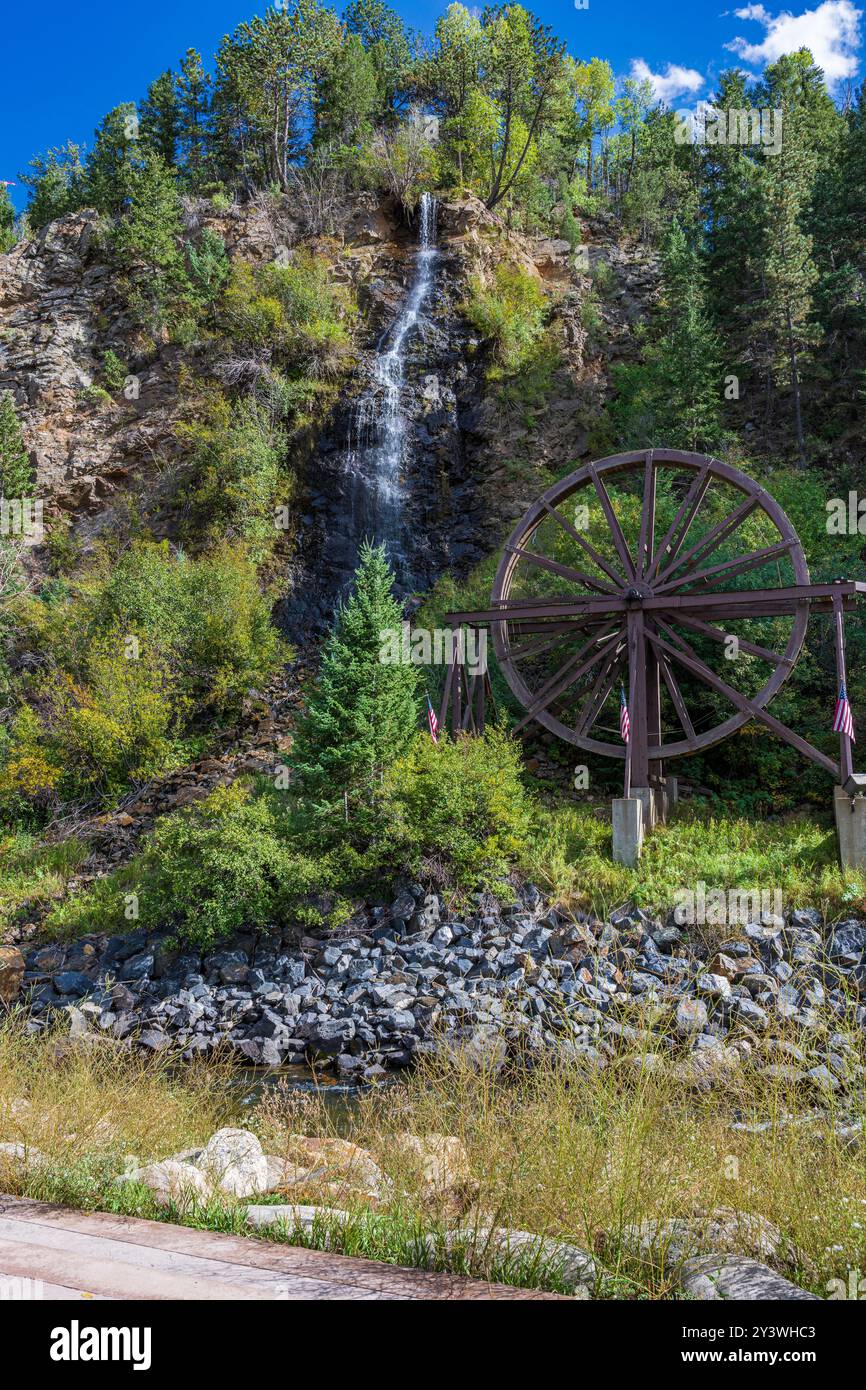 round the turn of the 20th Century, The wheel itself was part of a larger apparatus used for processing ore found on Charlie’s claim on Ute Creek.  Th Stock Photo