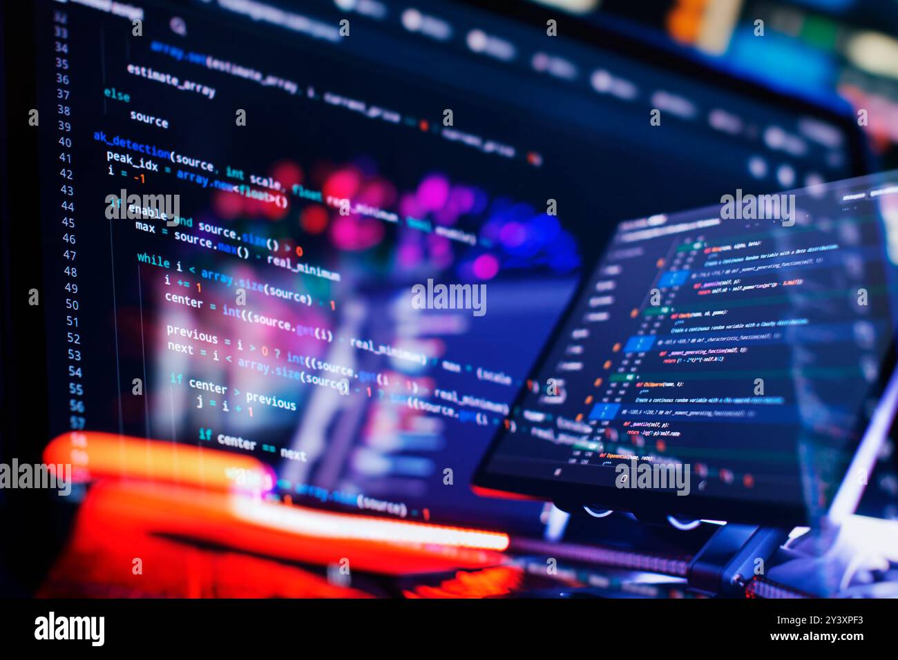 Work from home. Programmer coding code on notebook screen at Stock Photo
