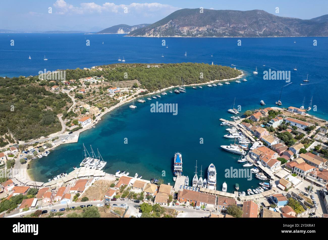 Drone aerial view Greek harbour village of Fiskardo on the Northern tip ...