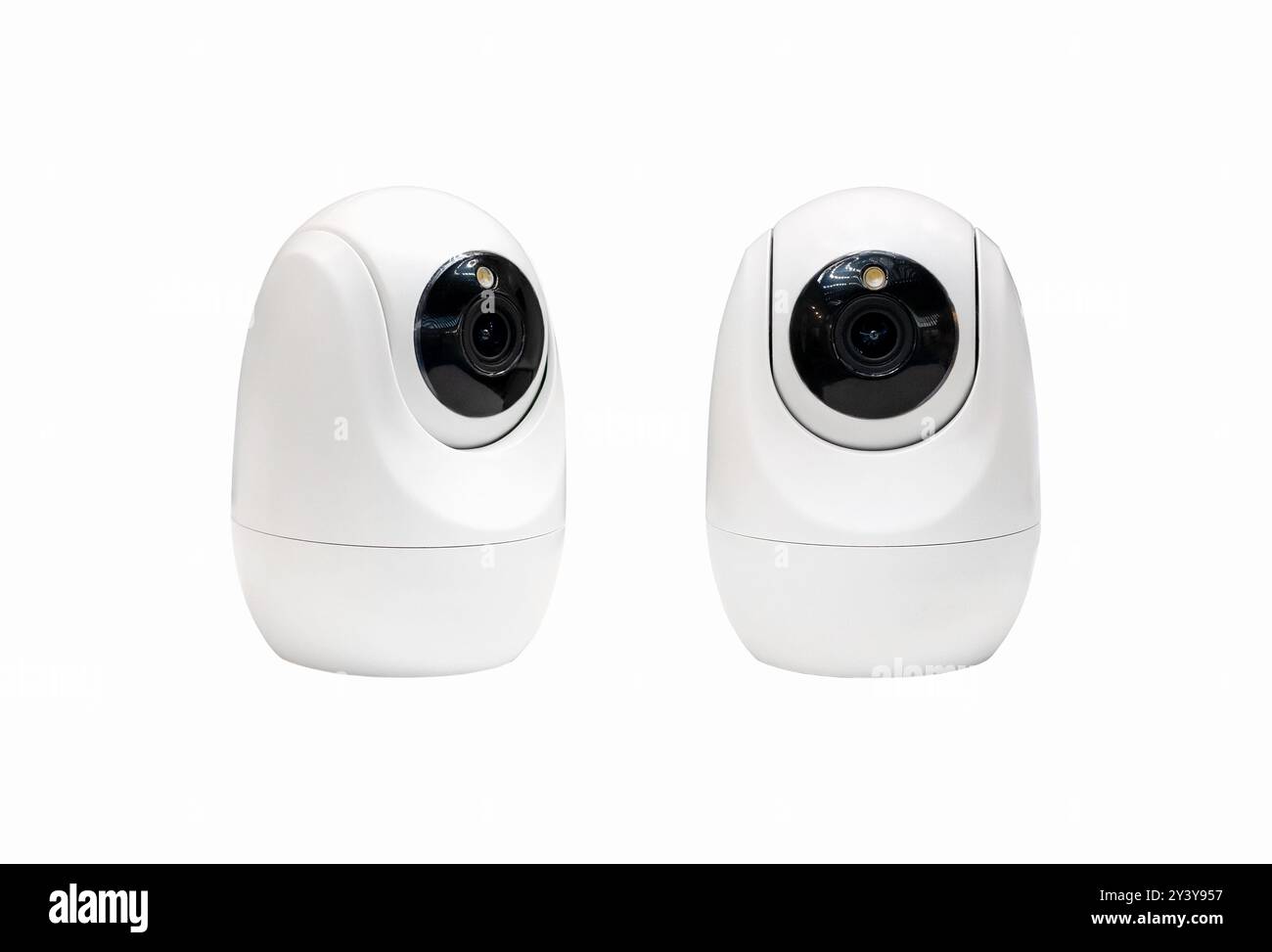Isolated indoors smart security camera. Surveillance cameras. Stock Photo