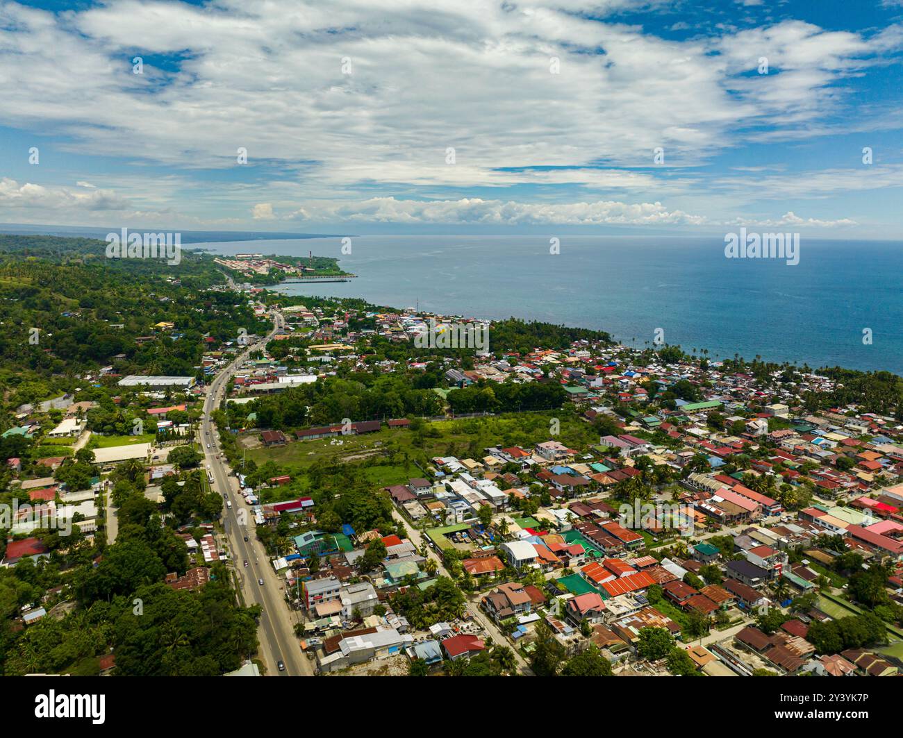 Iligan City with houses near at coast. Northern Mindanao, Philippines ...