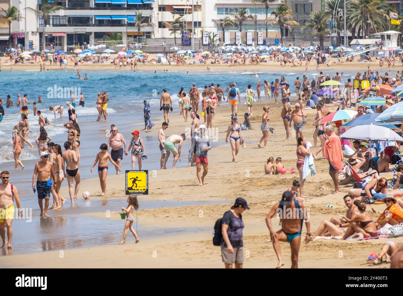 Gran Canaria, Canary Islands, Spain, 15th September 2024. British and German tourist join locals trying to keep cool on a packed city beach in Las Palmas on a swelterning day on Gran Canaria. Credit: Alan Dawson/Alamy Live News. Stock Photo