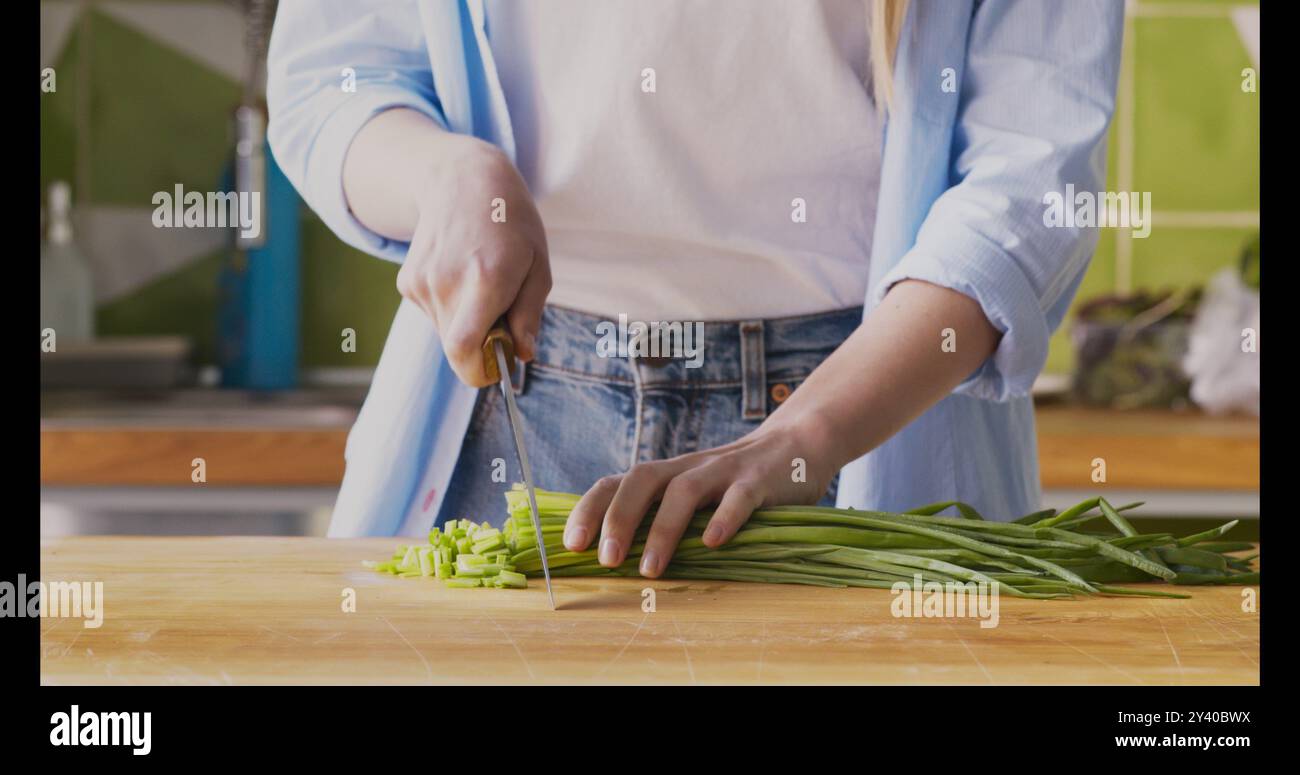 Female hands cut green onions hi-res stock photography and images - Alamy