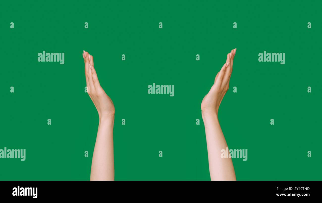 Hand frame. Advertising background. Female raised arms holding ...